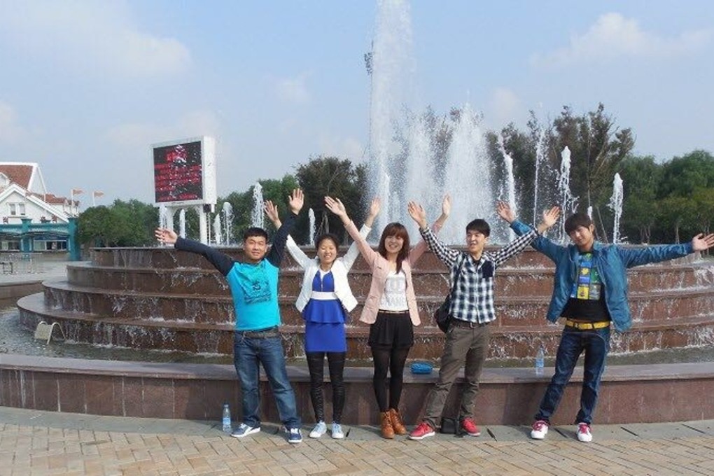 Mei Hechun, second from right, and his sister Mei JIng (in pink coat) with their friends. Photo: SCMP