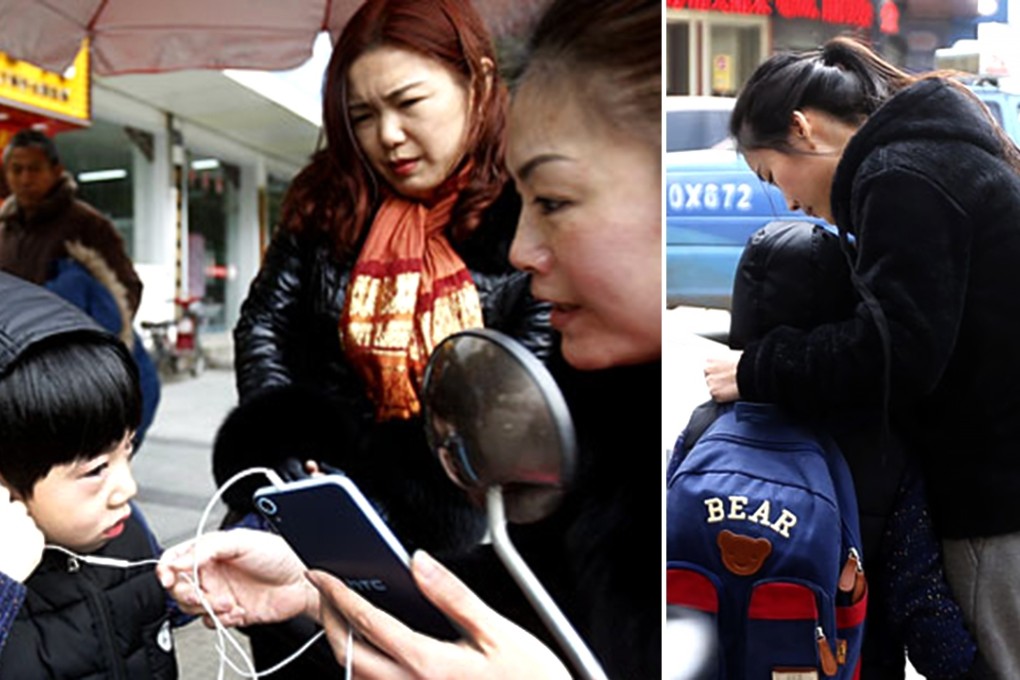 The lost little boy is helped to call his mother. Photo: SCMP Pictures