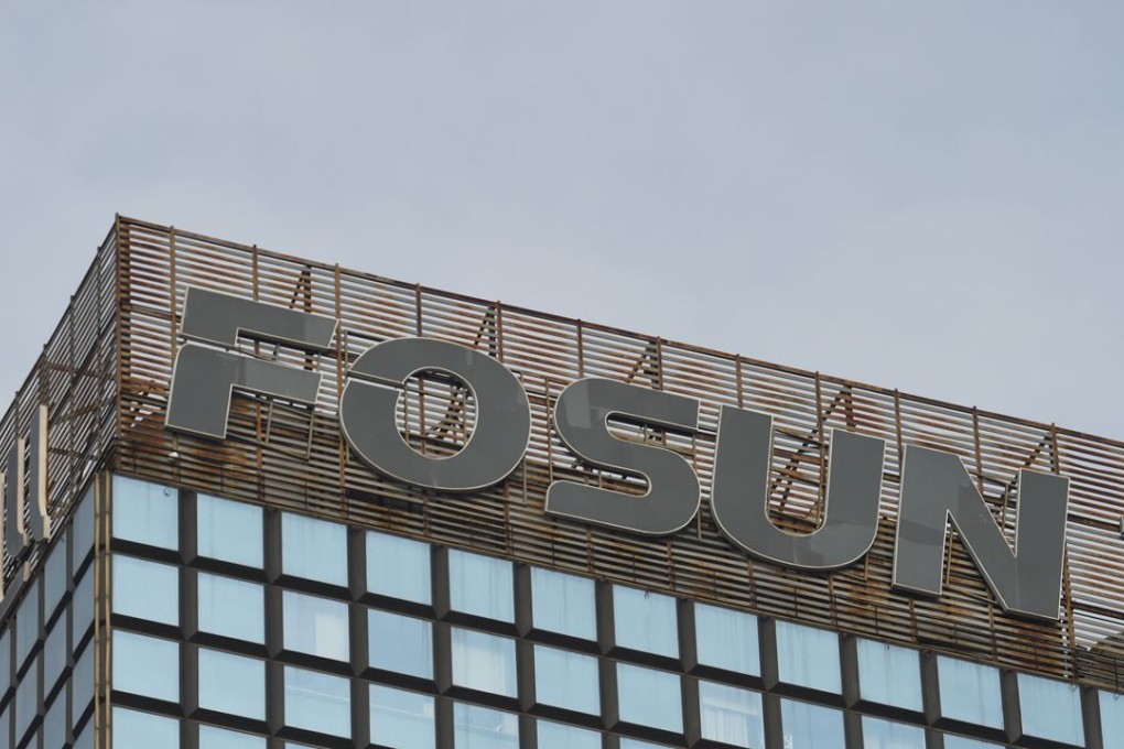 The logo of Chinese conglomerate Fosun is seen on top of a building in Beijing on December 12. Photo: AFP