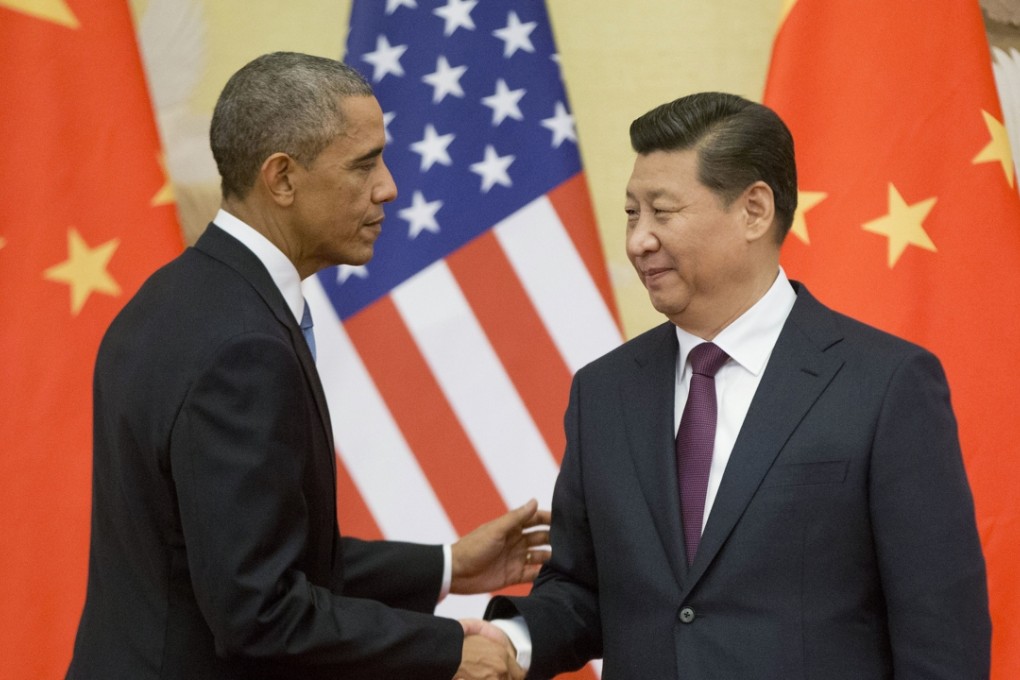 US President Barack Obama shakes hands with President Xi Jinping in Beijing in 2014. China and the United States together account for more than 40 per cent of global carbon dioxide emissions. Photo: AP