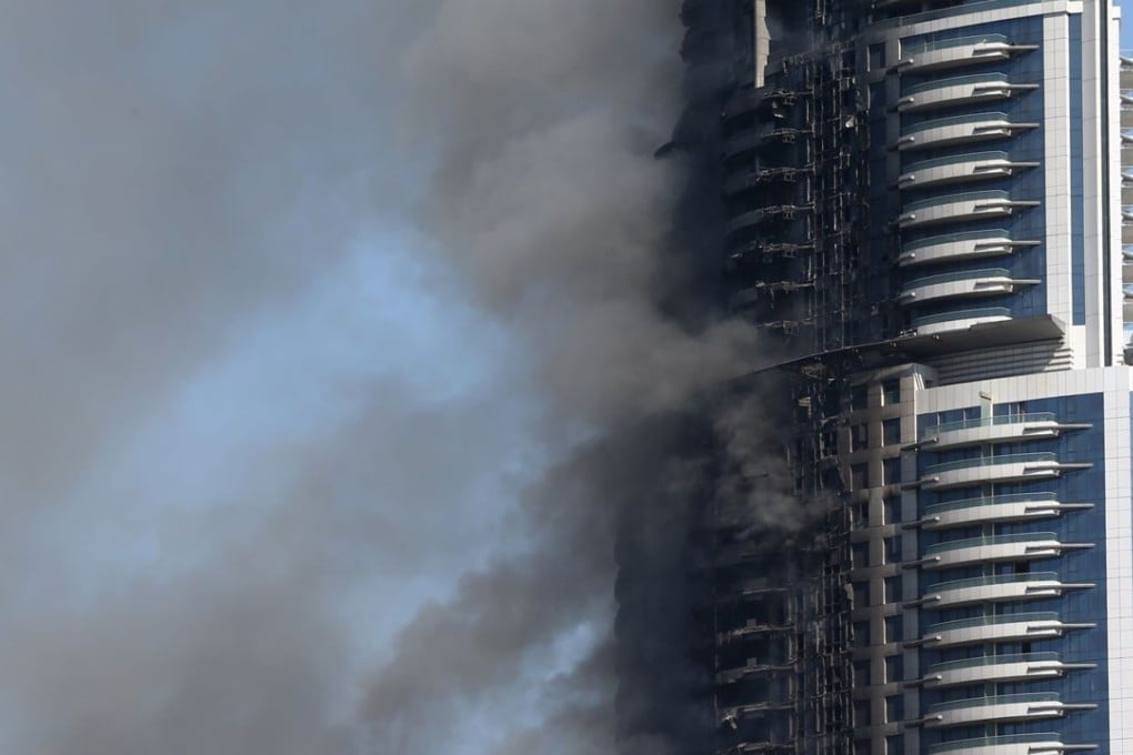 Smoke billows from the Address Downtown Hotel in Dubai on Friday, in the aftermath of a huge fire that engulfed several floors of the building. Photo: AFP