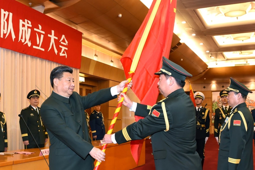 President Xi Jinping hands over a military flag to General Li Zuocheng, commander of the newly established general command of the PLA’s Army. Photo: Xinhua