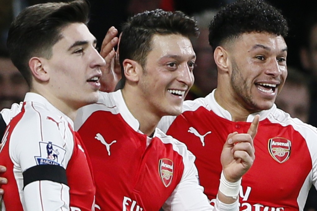 Arsenal’s Hector Bellerin, Mesut Ozil and Alex Oxlade Chamberlain have plenty to celebrate with Arsenal sitting pretty at the top of the Premier League. Photo: Reuters