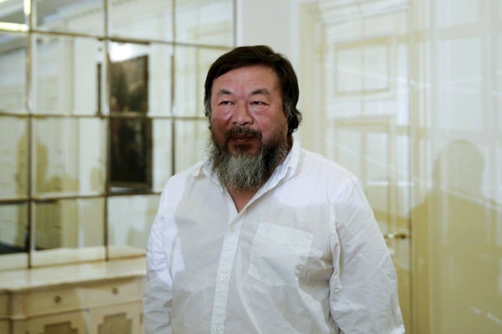 Chinese artist Ai Weiwei poses for photographers following a news conference about his visit to the Greek island of Lesbos where about 500,000 refugees and migrants arrived last year, in Athens on Friday. Photo: Reuters