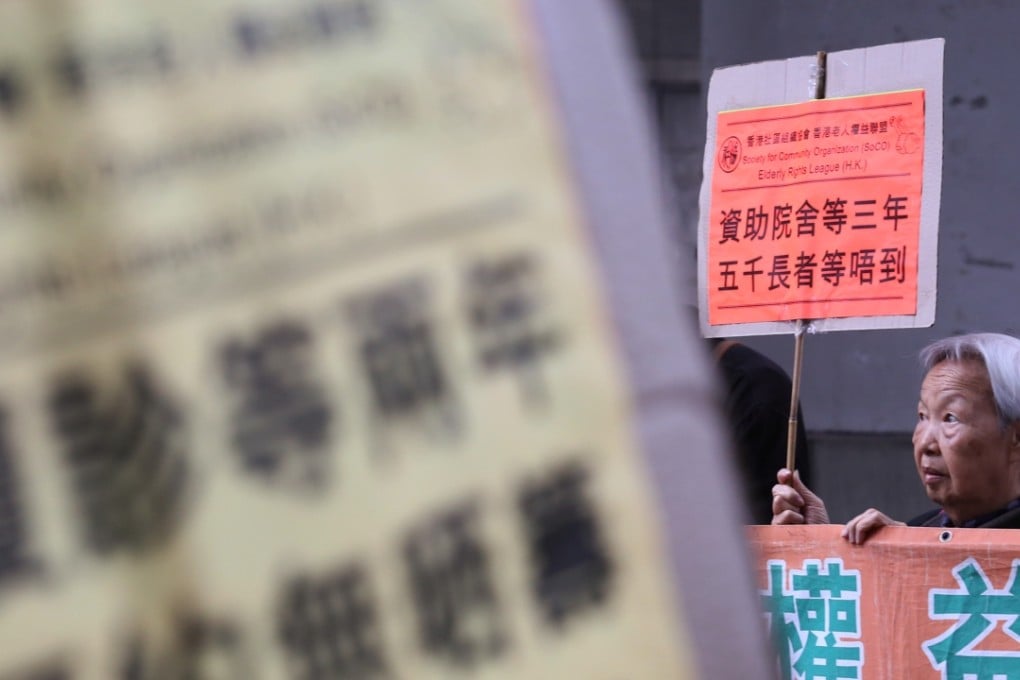 Elderly people from the Society for Community Organisation (SoCO) and Elderly Rights League protest against the consultation on retirement protection and call on the government to safeguard elderly benefits. Photo: Nora Tam