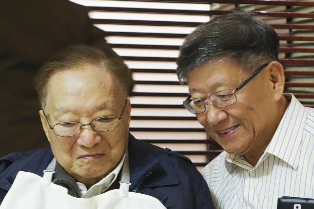 Patrick Wang (right) with his former editor at Ming Pao, Louis Cha, in 2014.