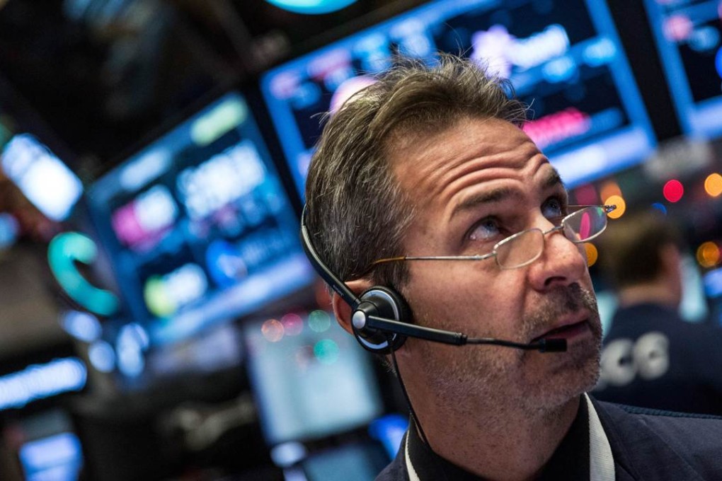 A trader works on the floor of the New York Stock Exchange on Monday morning. Photo: AFP