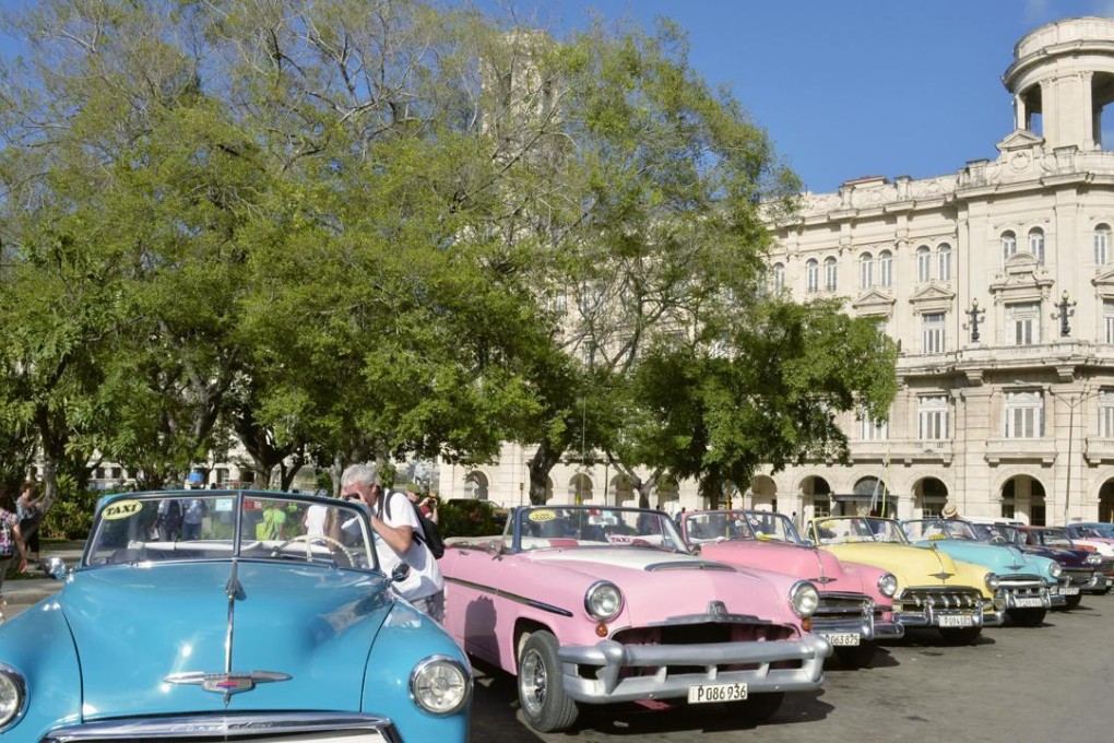 Classic American-made cars and Spanish architecture are two of the elements that make Havana an attractive tourist destination. Photo: Kyodo