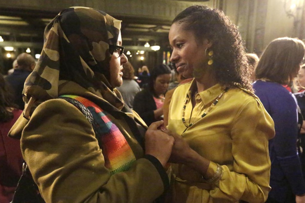 Wheaton College professor Larycia Hawkins, right, is greeted by supporter Donna Demir after a news conference on Wednesday in Chicago. Photo: AP
