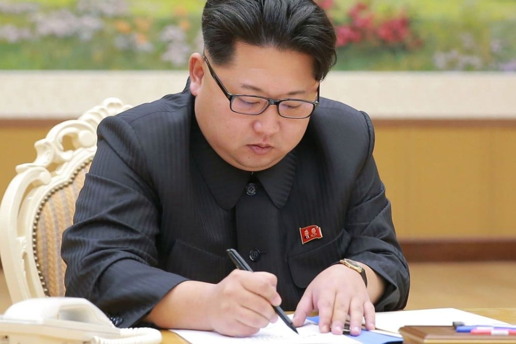 North Korean leader Kim Jong-un signs a document for a hydrogen bomb test in Pyongyang. North Korea announced on January 6 it had successfully carried out its first hydrogen bomb test, an event that, if confirmed, would mark a stunning step forward in its nuclear development. Photo: AFP