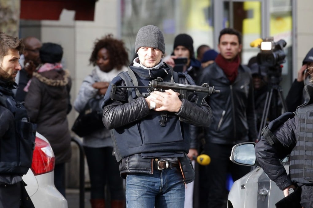 The man was wearing what looked like an explosive vest, but it was fake, according to two French police officials. Photo: AP