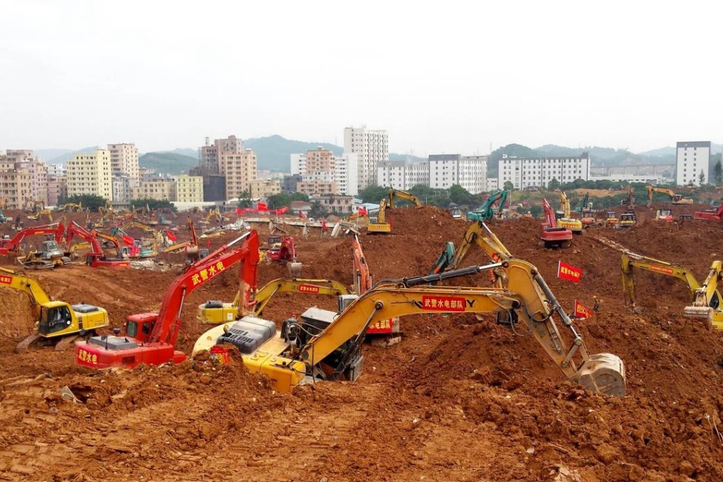 Excavators working at the scene of the disaster last month. Photo: AFP