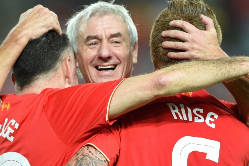 Ian Rush, flanked by John Arne Riise and John Aldridge celebrate a goal for the Liverpool Legends against an Australian Legends side in an exhibition game in Sydney. Photos: AFP