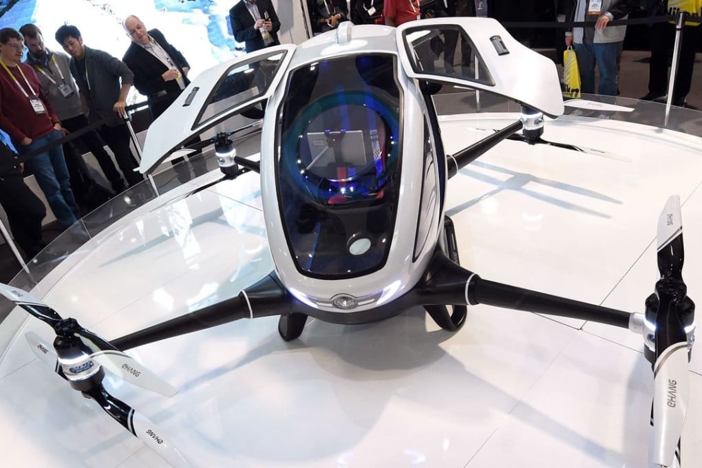 CES 2016 attendees gaze at an EHang 184 autonomous-flight drone that can fly a person at the Las Vegas Convention Centre. Photo: Getty