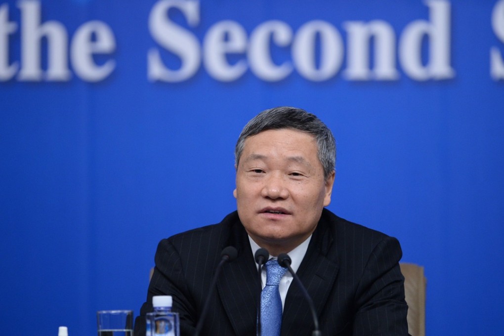 A file photo of Xiao Gang, president of China Securities Regulatory Commission, speaking at a press conference for the second session of China's 12th National People's Congress on financial reform in Beijing on March 11, 2014. Photo: Xinhua