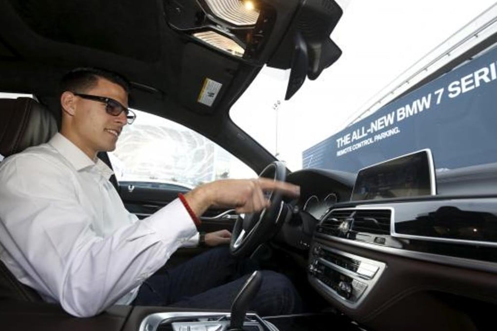 BMW’s Vlatko Kalinic demonstrates a gesture control feature to control the radio volume in a 2016 BMW 750i sedan during the 2016 CES trade show in Las Vegas on Friday. Photo: Reuters