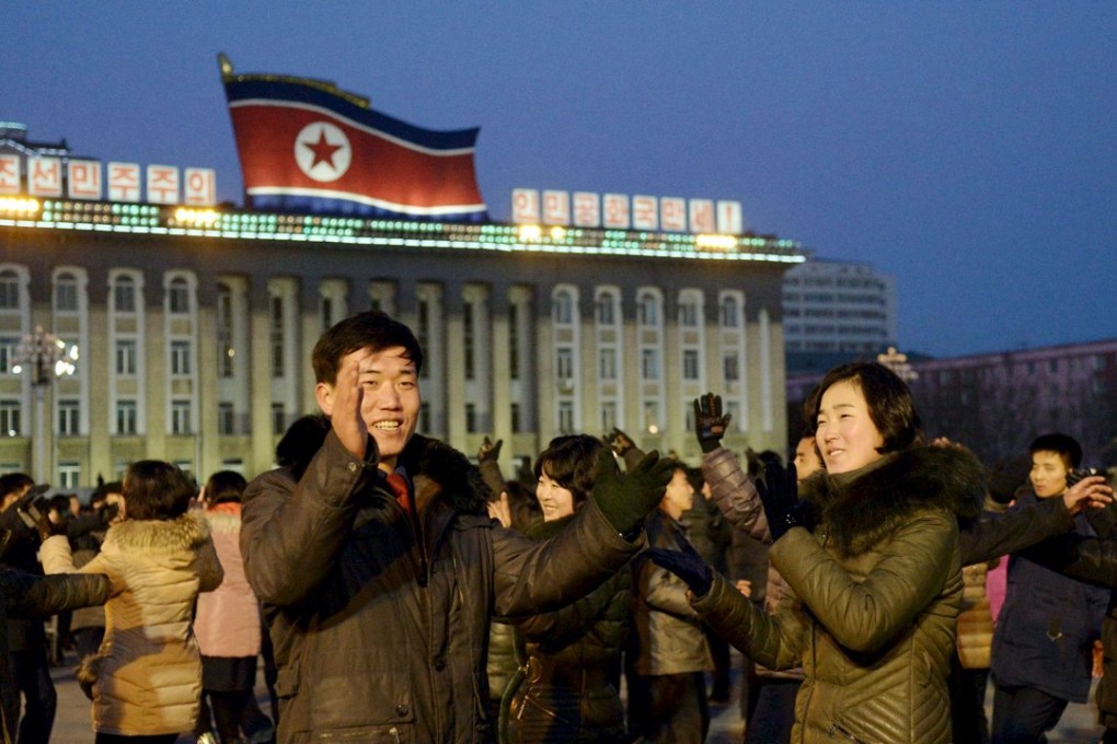 North Koreans dance in Kim Il-sung Square in Pyongyang, North Korea,to celebrate what the country claims was a "successful hydrogen bomb" test. Photo: Reuters