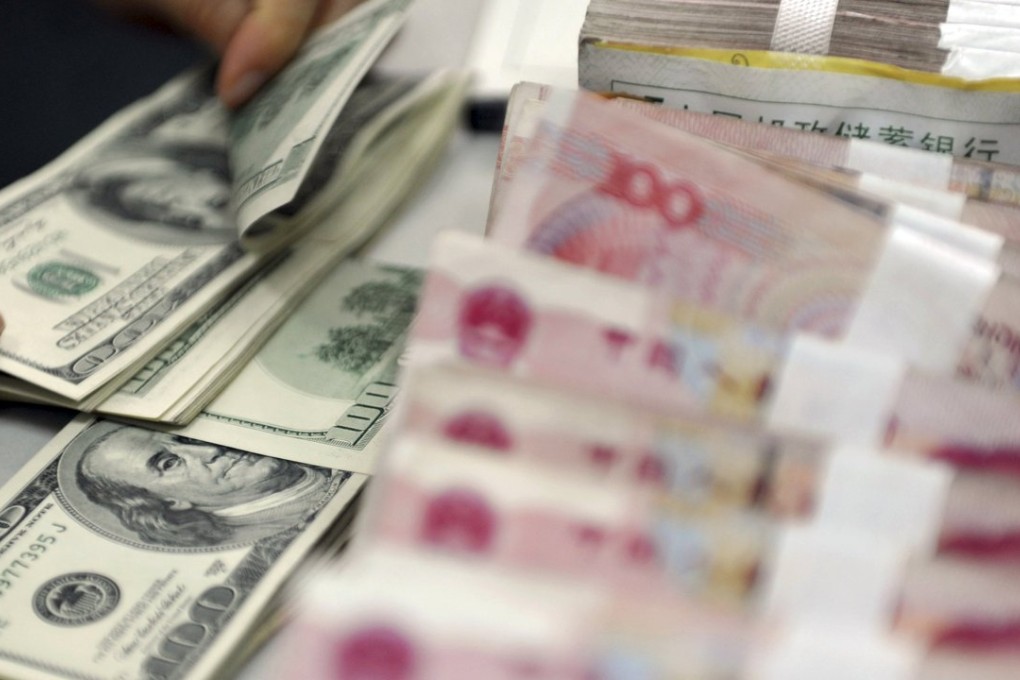 The State Administration of Foreign Exchange has ordered banks in some areas to limit US dollar purchases this month to curb outflows. Photo: Reuters