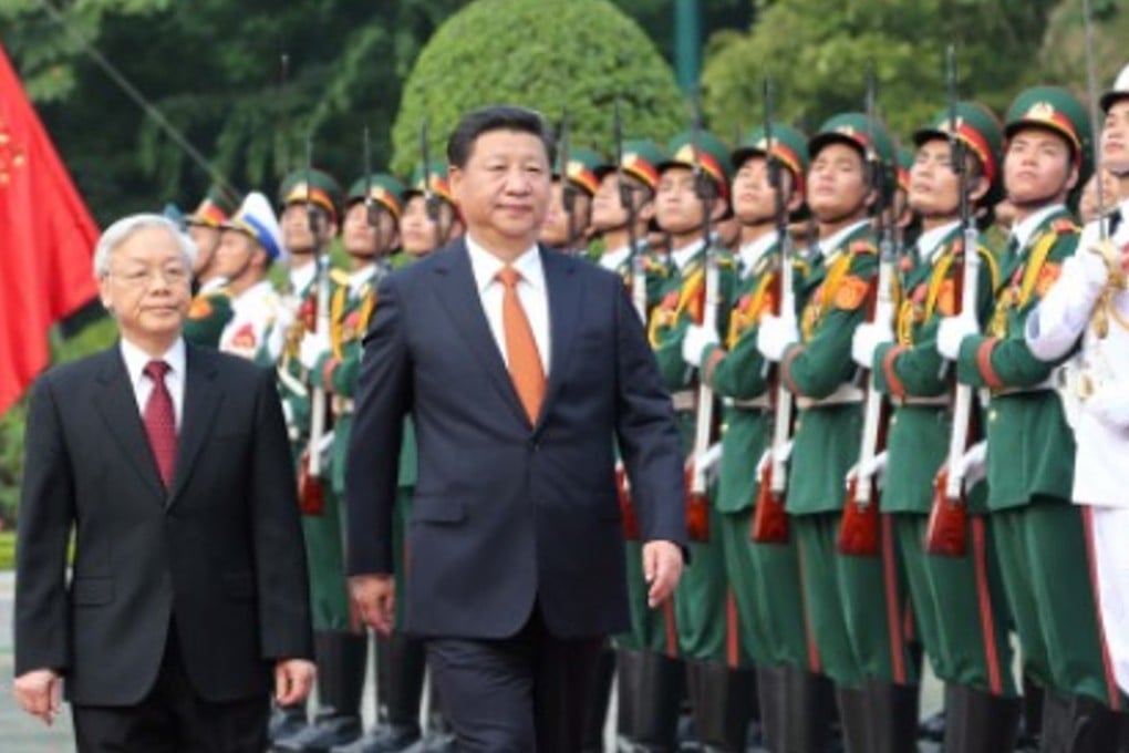 General Secretary of the Communist Party of Vietnam Nguyen Phu Trong (left) gave a warm welcome to Chinese President Xi Jinping before their talks in Hanoi in early November, but protests marked Xi’s visit due to the two sides’ simmering territorial disputes in the region. Photo: Xinhua.