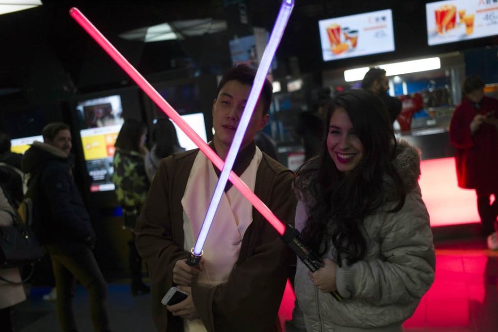 Fans pose for pictures ahead of the premiere of "Star Wars: The Force Awakens" in Beijing. Photo: AFP