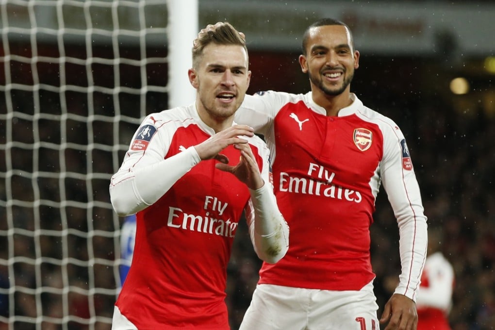 Aaron Ramsey celebrates scoring the second goal for Arsenal with Theo Walcott. Photo: Reuters
