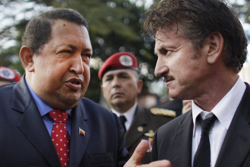 Venezuela's President Hugo Chavez, left, talks to US actor Sean Penn at the presidential palace in Caracas in 2012. Photo: AP