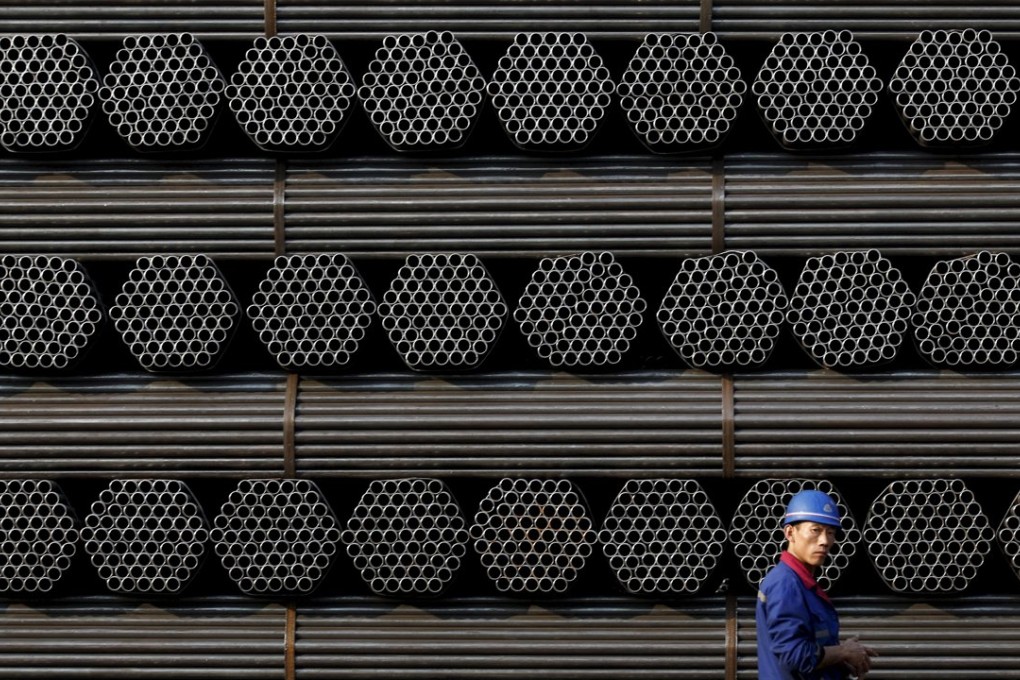 A steel plant worker in Hebei province. China’s economy probably grew at its slowest pace in 25 years in 2015. Photo: Reuters