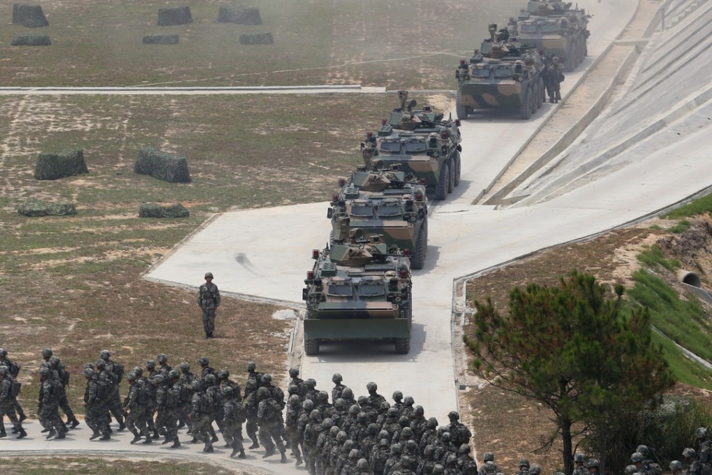 Troops from the Hong Kong garrison conduct military exercises in Tuen Mun in July. Photo: Felix Wong