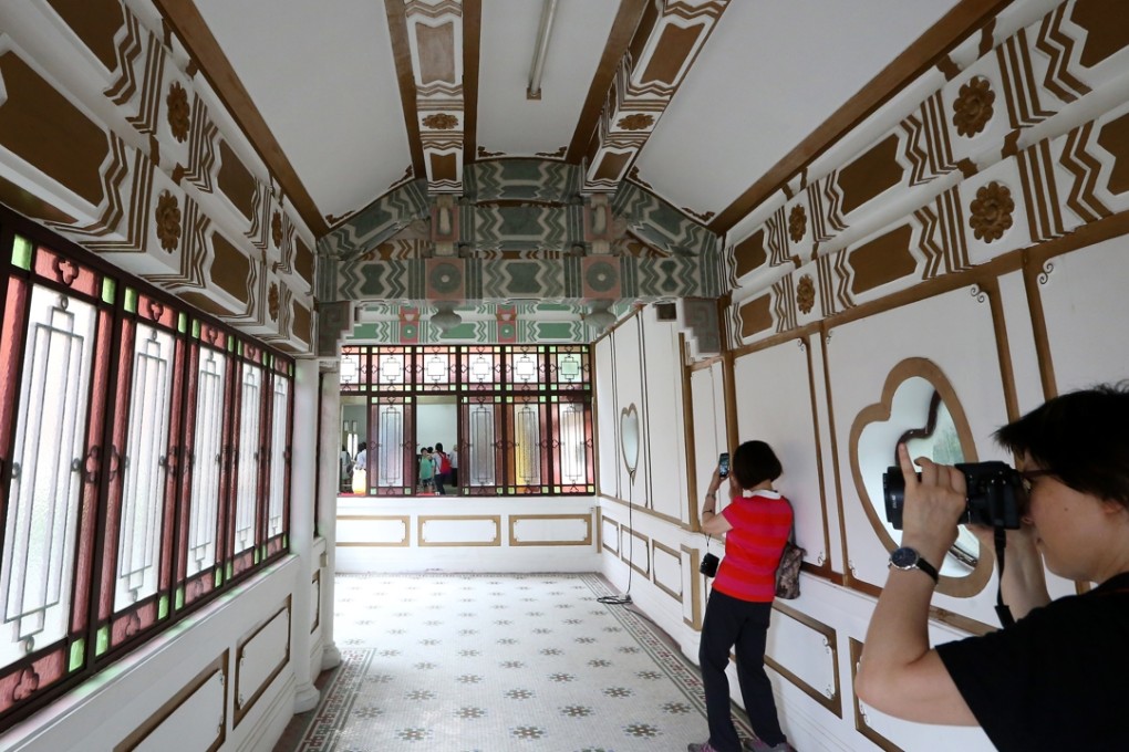 Visitors take pictures inside King Yin Lei mansion in Wan Chai, after it was rescued from destruction.