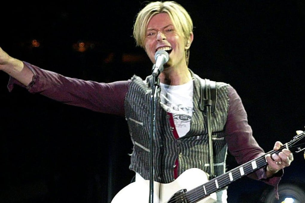David Bowie performing in 2003. His family announced today the rock star had died of cancer. Photo: AFP