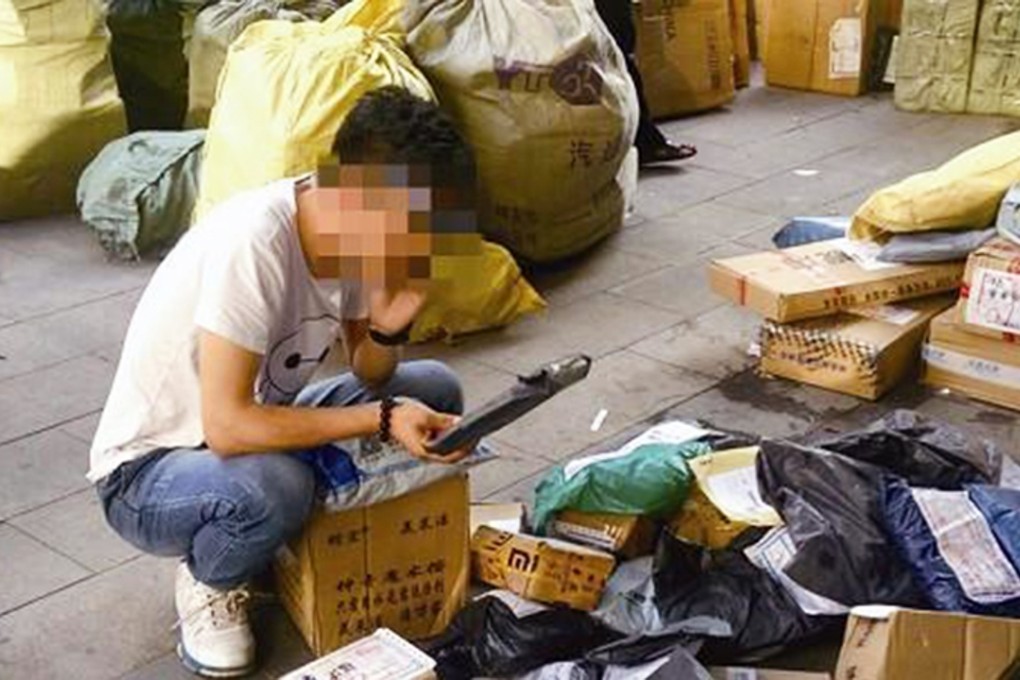 A courier organises his deliveries in mainland China. Photo: SCMP Pictures