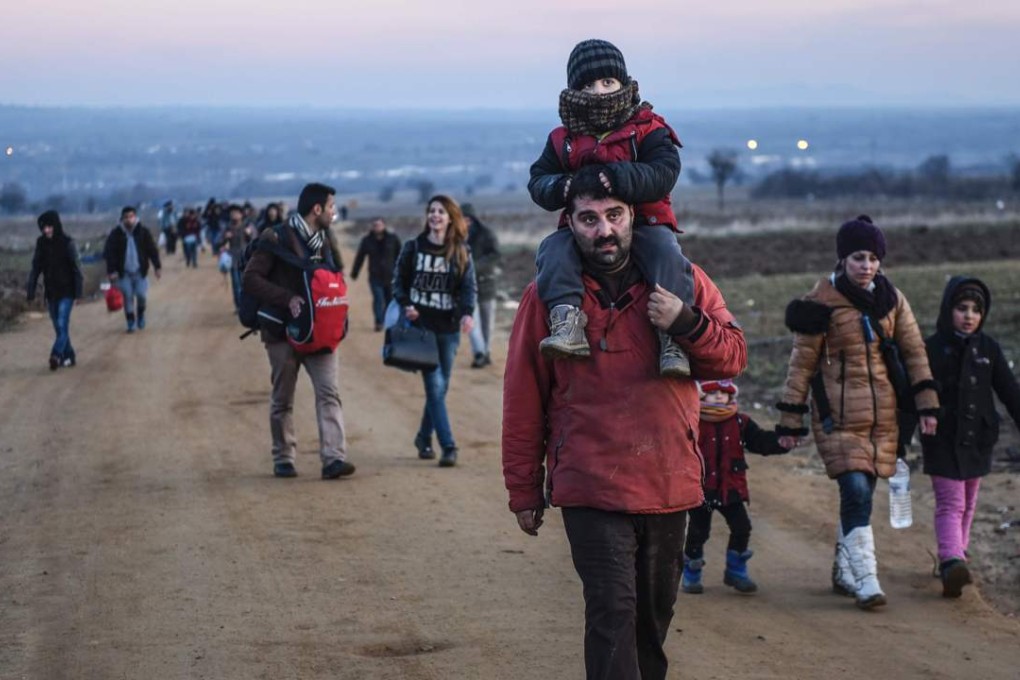 Migrants and refugees walk on after crossing the Macedonian border into Serbia. More than a million refugees arrived in Europe in 2015 in the worst crisis of its kind since the second world war. Photo: AFP