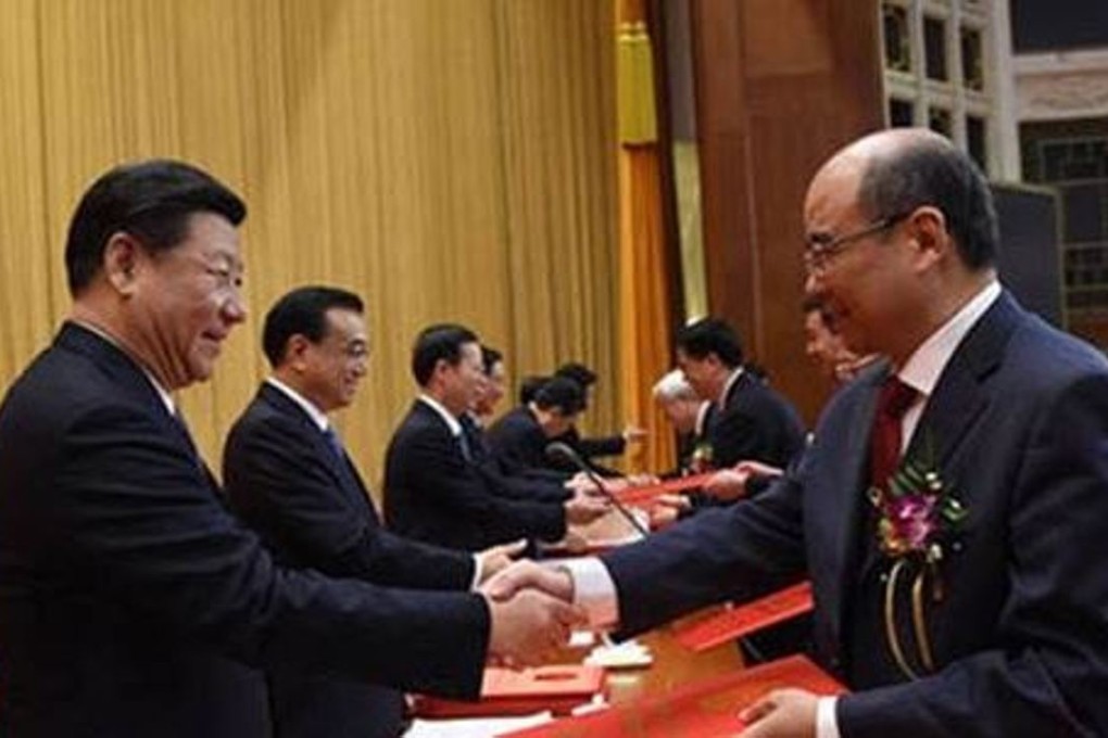 Hyperspectral imaging expert Xiang Libin (right) receives the prestigious accolade from President Xi Jinping during the annual national science and technology awards ceremony in Beijing on Friday. Credit: Xinhua
