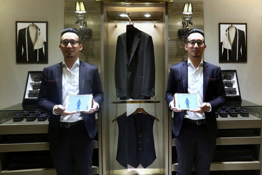 The company uses 14 infrared sensors to scan a customer’s body and provide 120 precise measurements, but the 3D tech is more interested in keeping a firm record of this traditional craft, according to Gay Giano’s business development director Matthew Lee (pictured here in a reflected surface). Photo: Jonathan Wong