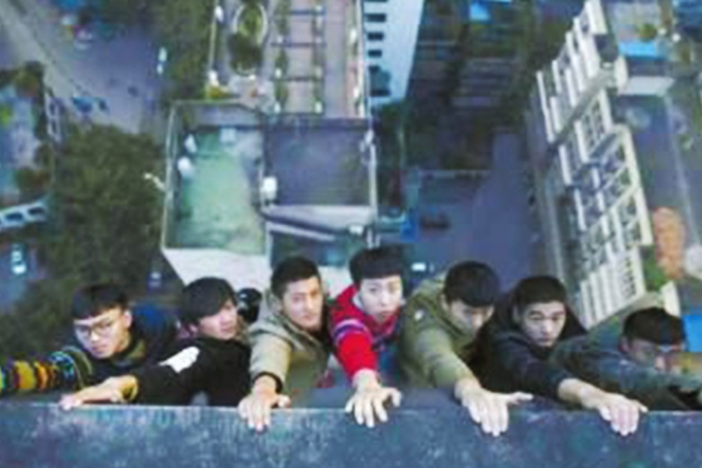 The students from Sichuan go out on a limb to make their point. Photo: SCMP Pictures