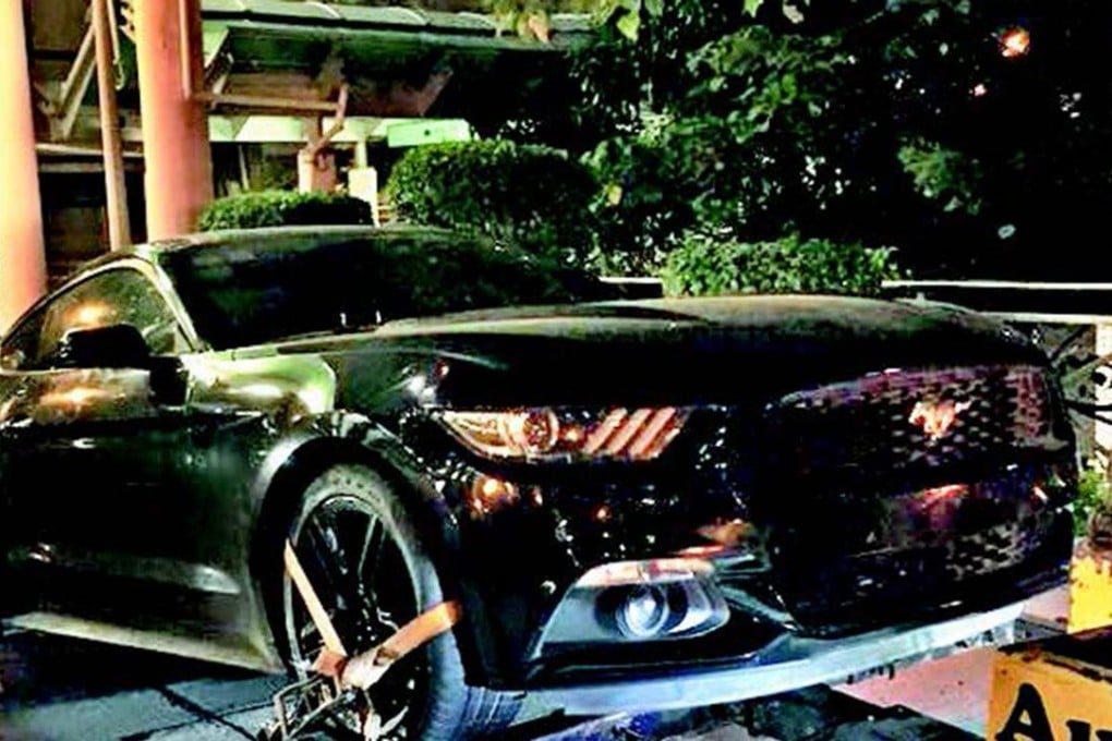 A 24-year-old mainland Chinese man sped through the Hong Kong-Shenzhen border in his mother's black Ford Mustang but was caught three days later in Sheung Wan. Photo: SCMP Pictures