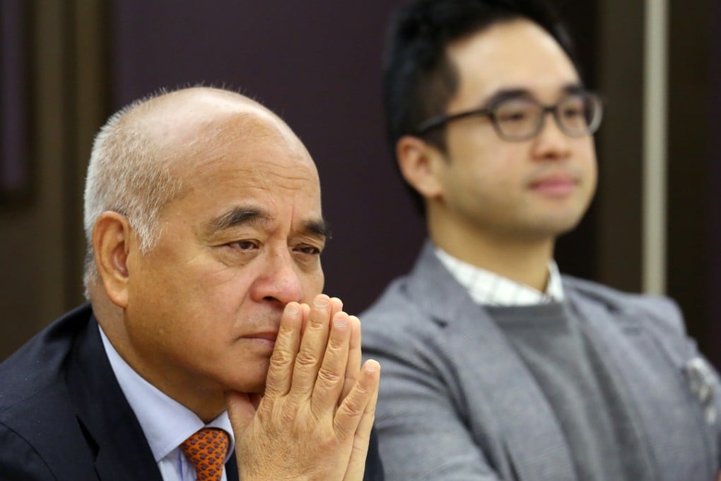 New World Development Chairman Henry Cheng Kar-shun (left) meets the press with his son Executive Vice-chairman Adrian Cheng Chi-kong at the New World Tower in Central on Monday. Photo: Nora Tam