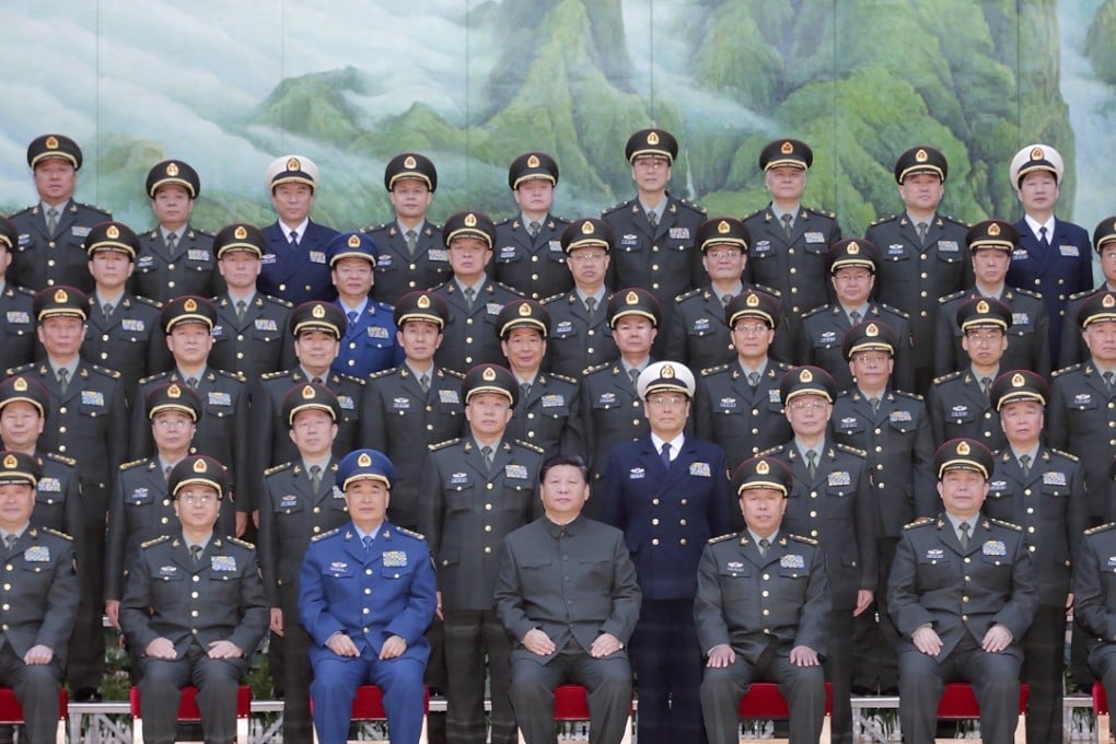 President Xi Jinping, centre front, poses for a group photo during a meeting with the new heads of the reorganised organs of the Communist Party's Central Military Commission in Beijing on Monday. Photo: Xinhua