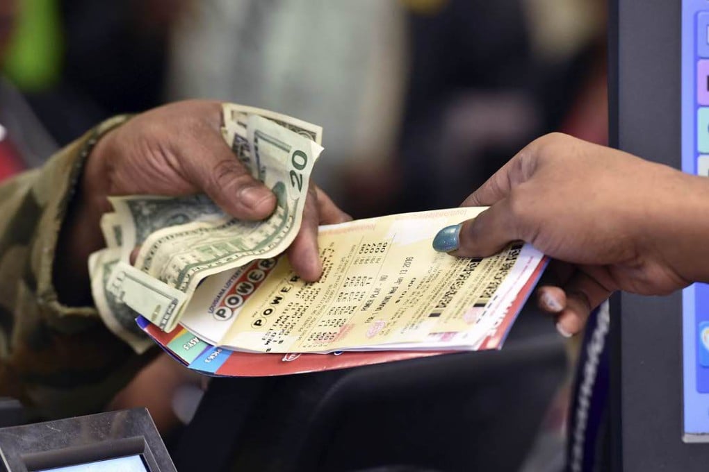 A customer buys tickets for the Powerball jackpot lottery in Delta, Louisiana, on Tuesday. Photo: AP