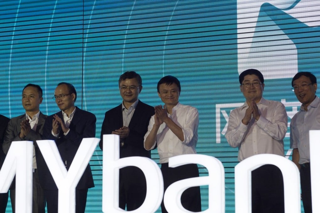 Alibaba founder Jack Ma Yun(fifth from left) is shown attending the opening ceremony of MYbank in Hangzhou, Zhejiang Province last June 25. MYbank had a registered capital of 4 billion yuan (US$655 million) and was created to focus on providing financial services for small- and micro -businesses, as well as online consumers. Photo: Xinhua