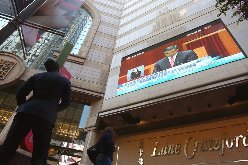 The highly anticipated policy address was closely watched by many and broadcast around town. Photo: Jonathan Wong