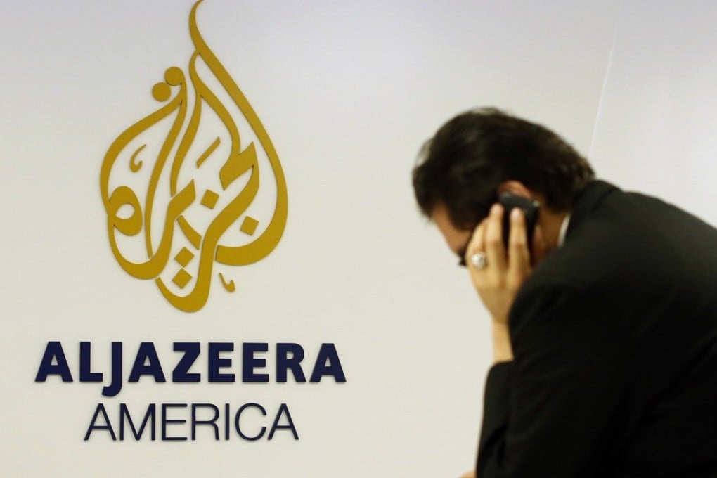 A man works at a desk in the Al Jazeera America broadcast centre in New York, in a file photo. The channel will cease US operations by April 30. Photo: Reuters