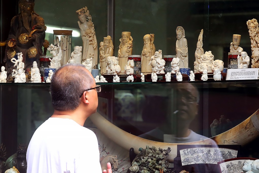 Ivory carvings and crafts are displayed in a shop on Hollywood Road. The operator’s future is now in doubt. Photo: SCMP Pictures