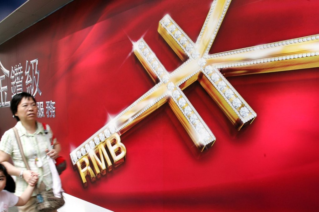 A sign outside a Hong Kong bank advertises yuan business. Photo: AFP