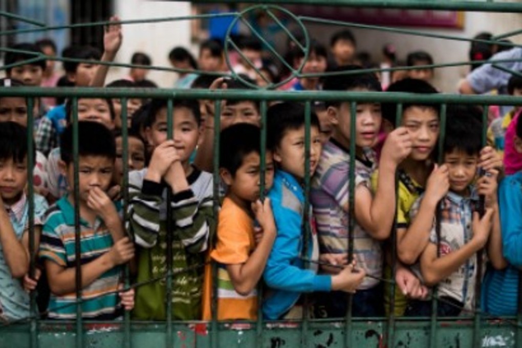 A file picture of children at a school in the Guangxi region of southern China. Poorer areas like Guangxi and Guizhou have many “left-behind children”, the offspring of migrant workers based away from home. Photo: AFP