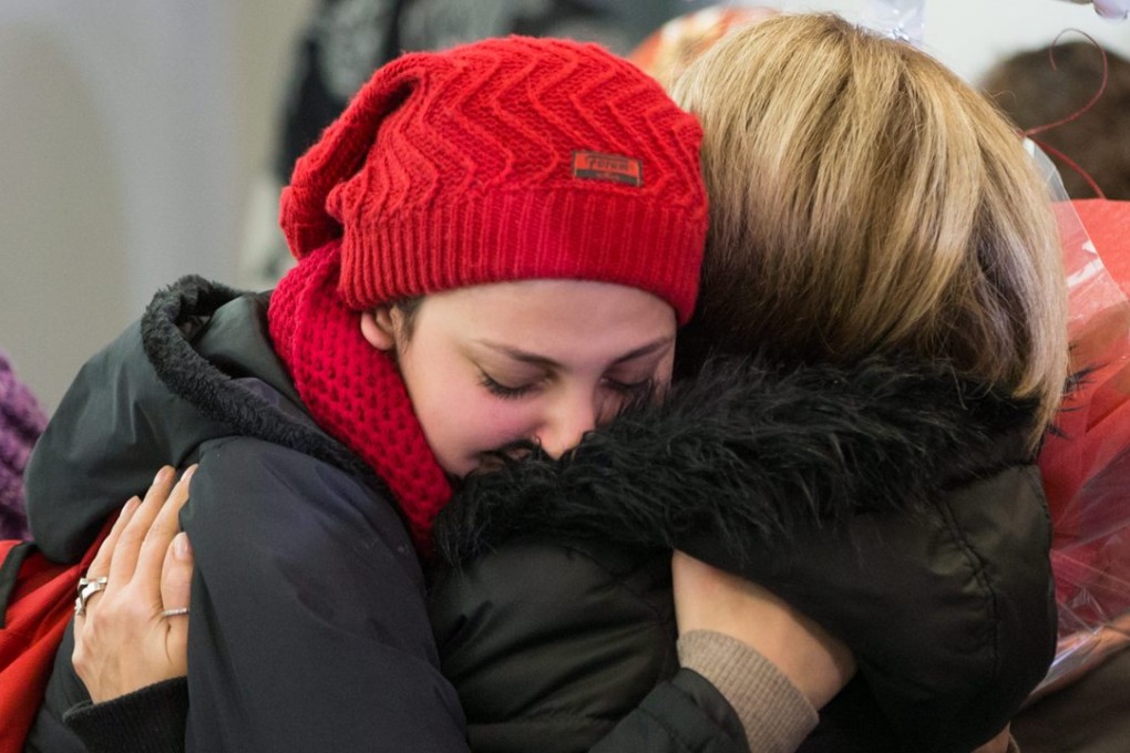 Newly arrived Syrian refugee Haveen Kurdi, left, hugs her aunt, Vancouver-area resident Tima Kurdi, at Vancouver International Airport on December 28. The family of Aylan Kurdi, the little boy who washed up dead on a Turkish beach and prompted a worldwide outpouring of sympathy, is among the 10,000 Syrian refugees who have arrived in Canada. Photo: AP