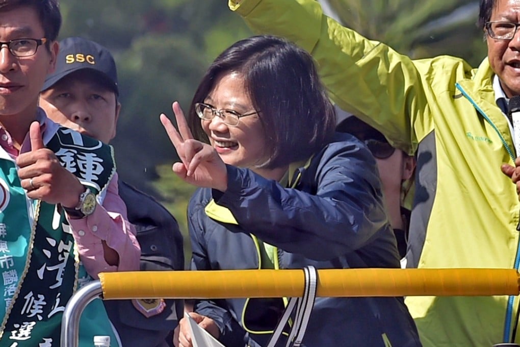 Taiwan presidential frontrunner, Tsai Ing-wen (centre) of the Democratic Progressive Party (DPP), kicked off the final week of campaigning in Fenggang village, her father's hometown in southern Pingtung county. Photo: AFP