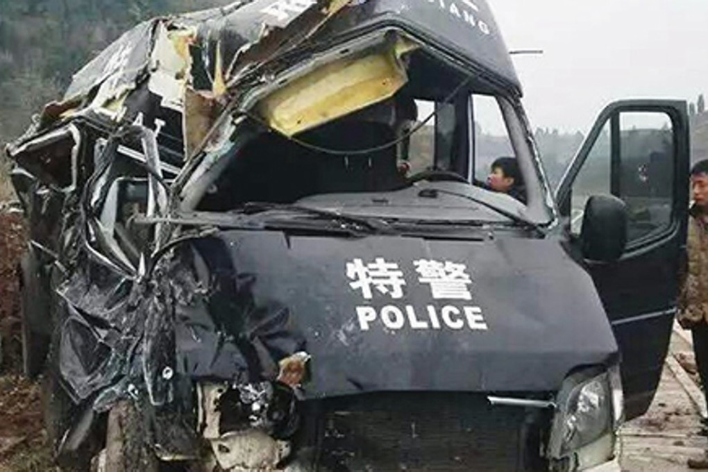 The wreckage of the minivan that was carrying 13 police SWAT team members .
