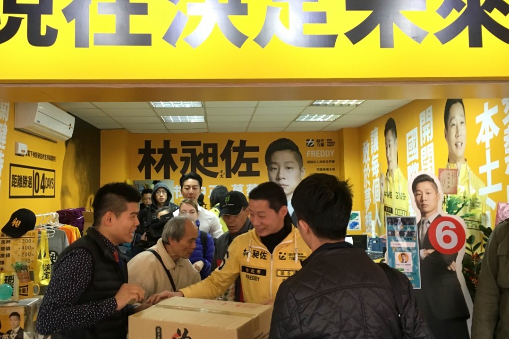Freddy Lim, a heavy-metal-performer-turned candidate, at his election headquarters. The New Power Party candidate represents the values many Taiwanese youth have embraced after the 2014 sunflower movement. He stands a chance of defeating the long-time KMT incumbent in a Taipei district where the presidential office and one of the most run-down part of the city coexist.