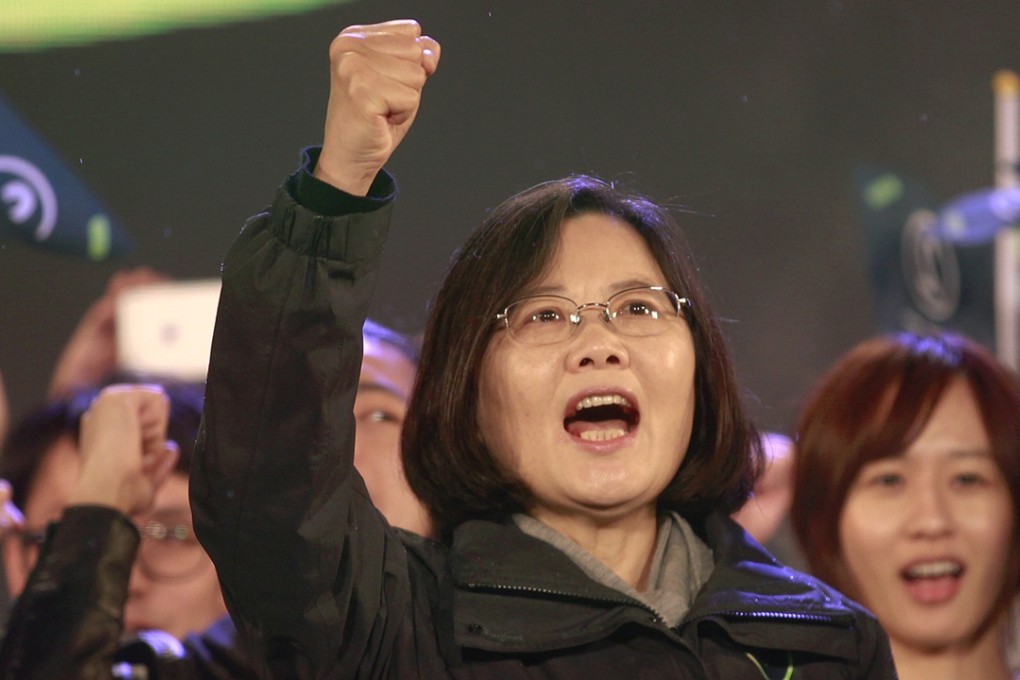 Taiwan's Democratic Progressive Party (DPP) Chairperson and presidential candidate Tsai Ing-wen shouts slogans from the stage during a final campaign rally ahead of the elections. Photo: Reuters